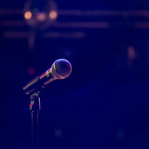 black and gray microphone on black stand